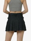 Black pleated skirt worn by a mannequin on a white background