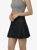 Black pleated skirt worn by a person on a white background