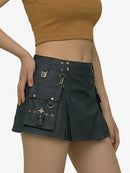 Black skirt with silver buckles worn by a person on a white background