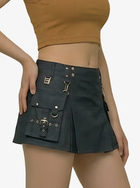 Black skirt with silver buckles worn by a person on a white background