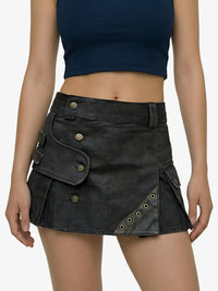 Black skirt with button details worn by a person on a white background