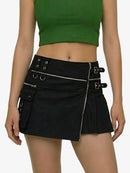 Black skirt with zippers and buckles worn by a person on a white background