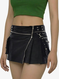 Black pleated skirt with silver zippers and buttons worn by a person on a white background
