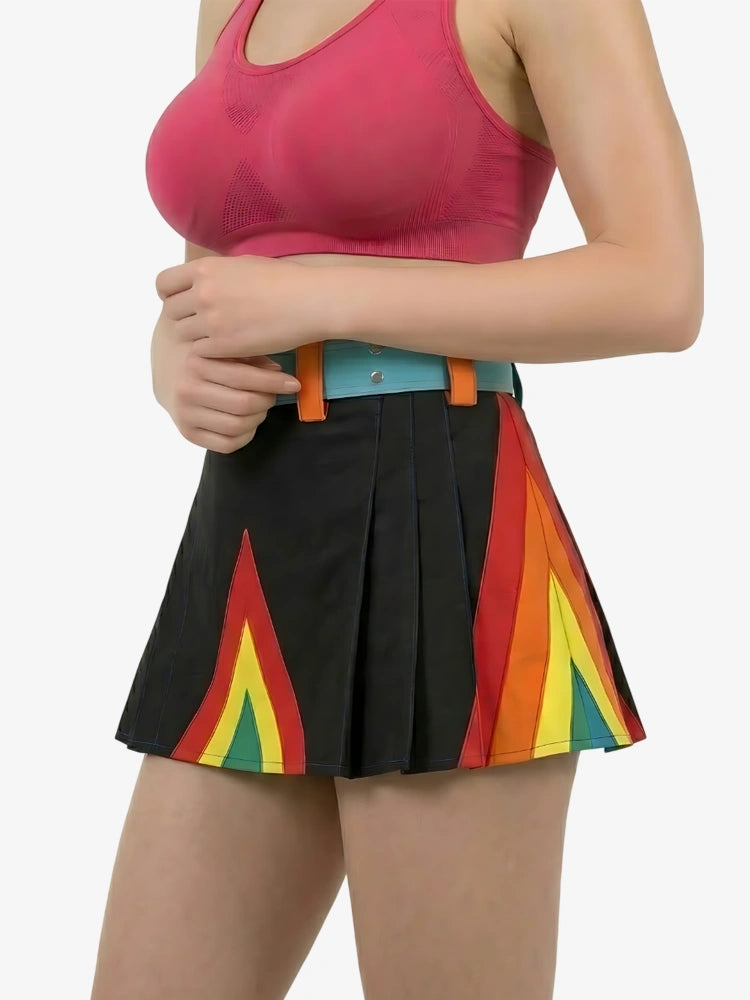 Person wearing a colorful skirt with a black background