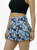 Person wearing a blue camouflage skirt on a white background