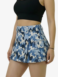 Person wearing a blue camouflage skirt on a white background