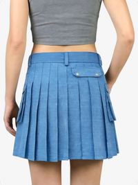 Blue pleated skirt worn by a person on a white background