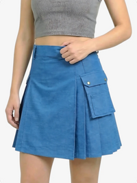 Blue skirt worn by a person on a white background