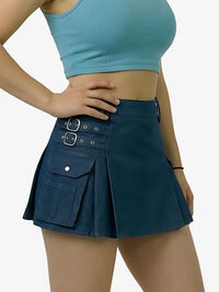 Person wearing a blue crop top and dark blue skirt on a white background