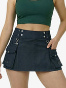 Person wearing a green crop top and black skirt with pocket details on a white background