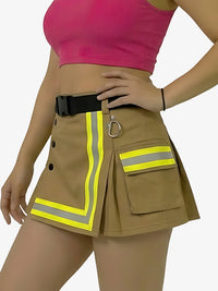 Person wearing a brown skirt with reflective stripes and a pink top on a white background