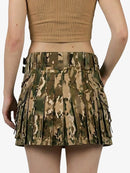 Camouflage pleated skirt worn by a person on a white background