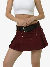 Person wearing a white crop top and maroon skirt with gold buttons on a white background
