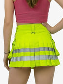 Person wearing a bright yellow safety skirt with reflective stripes on a plain background