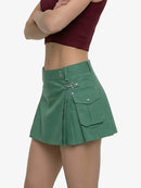 Green skirt worn by a person on a white background