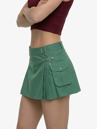 Green skirt worn by a person on a white background