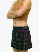 Person wearing a mustard yellow sleeveless top and a green plaid skirt on a white background