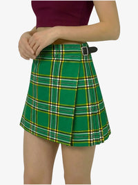 Green plaid skirt worn by a person on a white background