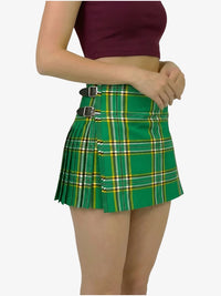 Green plaid skirt worn by a person on a white background