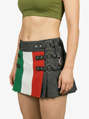Person wearing a skirt with a flag design and green crop top on a white background