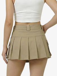Person wearing a beige pleated skirt and white top on a white background