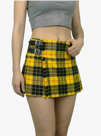 Person wearing a yellow and black plaid skirt on a white background