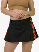 Black skirt with orange stripes worn by a person on a white background