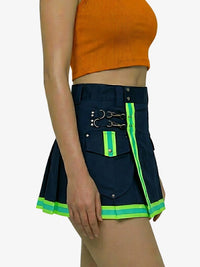 Navy pleated skirt with green accents worn by a person on a white background