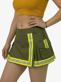 Person wearing a green safety skirt with reflective stripes on a white background