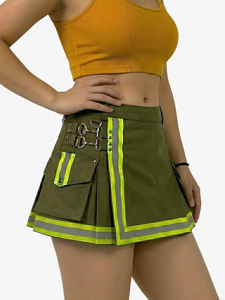 Person wearing a green skirt with reflective stripes and a mustard yellow top on a white background