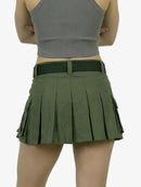 Green pleated skirt worn by a person on a white background