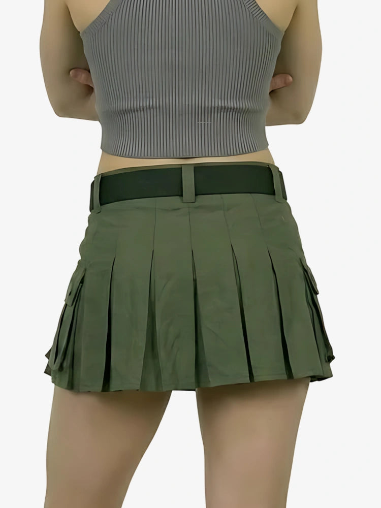 Green pleated skirt worn by a person on a white background