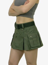 Green skirt with pockets and a belt worn by a person on a white background