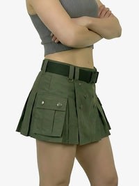 Person wearing a green skirt with pockets on a white background