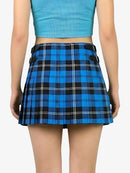 Blue plaid skirt worn by a person on a white background