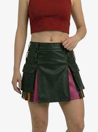 Green leather skirt with colorful accents worn by a person on a white background