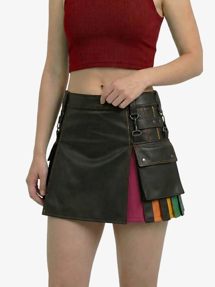Person wearing a black leather skirt with colorful accents on a white background