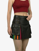 Black leather skirt with colorful accents worn by a person on a white background
