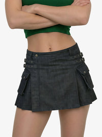 Person wearing a black denim skirt with button details on a white background