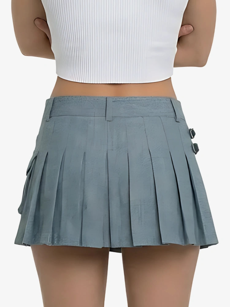 Person wearing a gray pleated skirt on a white background
