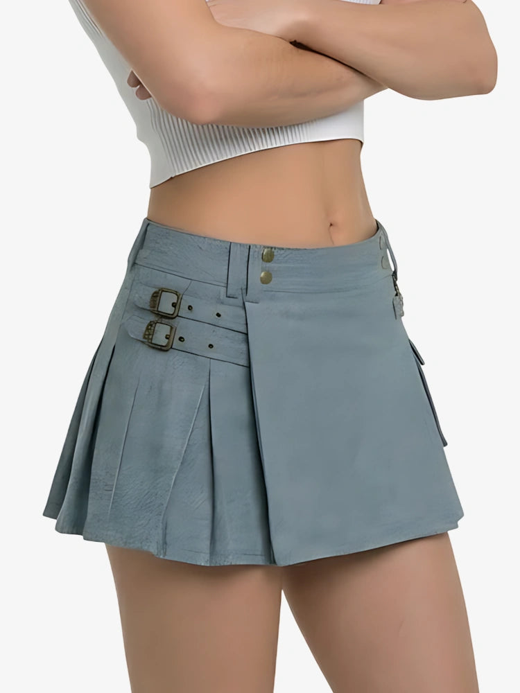 Person wearing a light blue pleated skirt on a white background