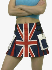 Person wearing a skirt with a Union Jack design on a plain background