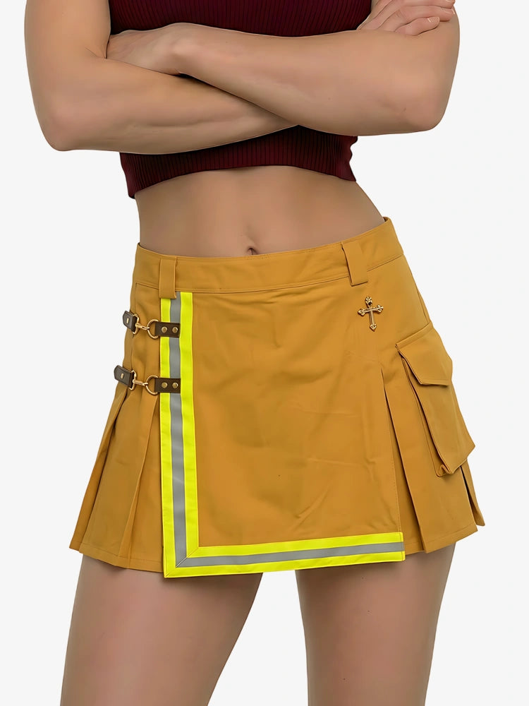 Person wearing a mustard yellow skirt with reflective stripes on a white background