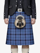 Person wearing a blue plaid kilt with a sporran on a white background