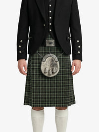 Person wearing a traditional Scottish kilt with a jacket on a white background