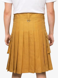 Mustard yellow pleated skirt worn with a white top on a plain background