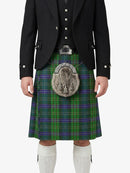 Person wearing a traditional Scottish kilt with a jacket on a white background