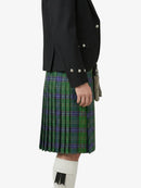 Person wearing a black jacket and green plaid kilt on a white background